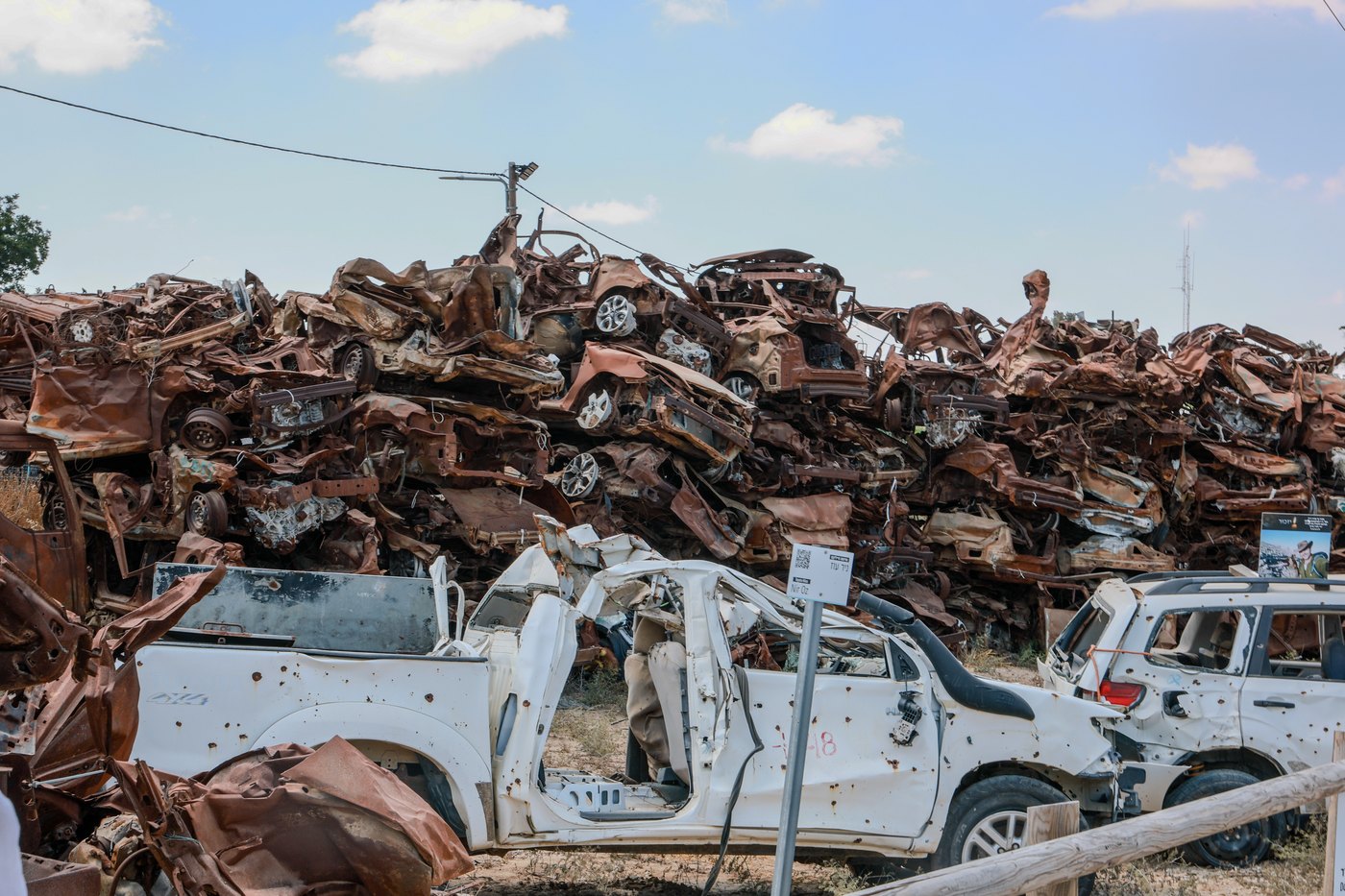 Destroyed and burned vehicles stacked at the memorial to the October 7 attack in Israel.